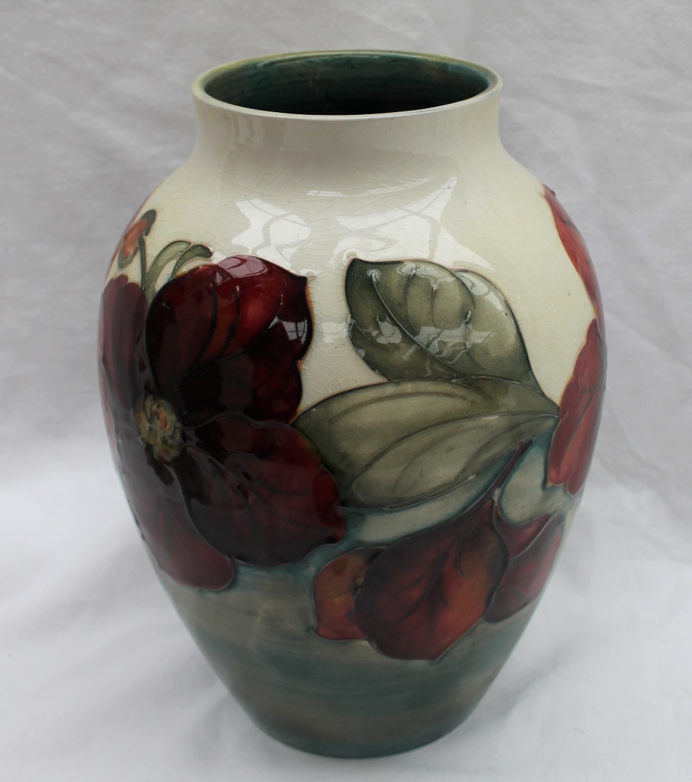 A Moorcroft Clematis pattern vase with a tapering neck to a cream ground, impressed mark, - Image 7 of 7