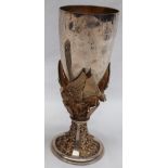 An Aurum silver goblet of tapering form, with griffins holding shields to a floral cast base,