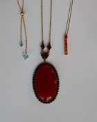 A hard stone and garnet pendant on a 9ct gold setting and chain together with two 9ct yellow gold