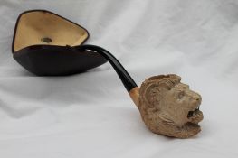 A Meerschaum pipe, the bowl carved as a lion's head, in a case with a Wm Astley & Co.