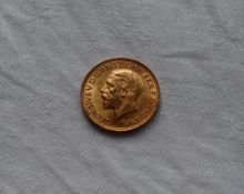 A George V gold sovereign, dated 1930,