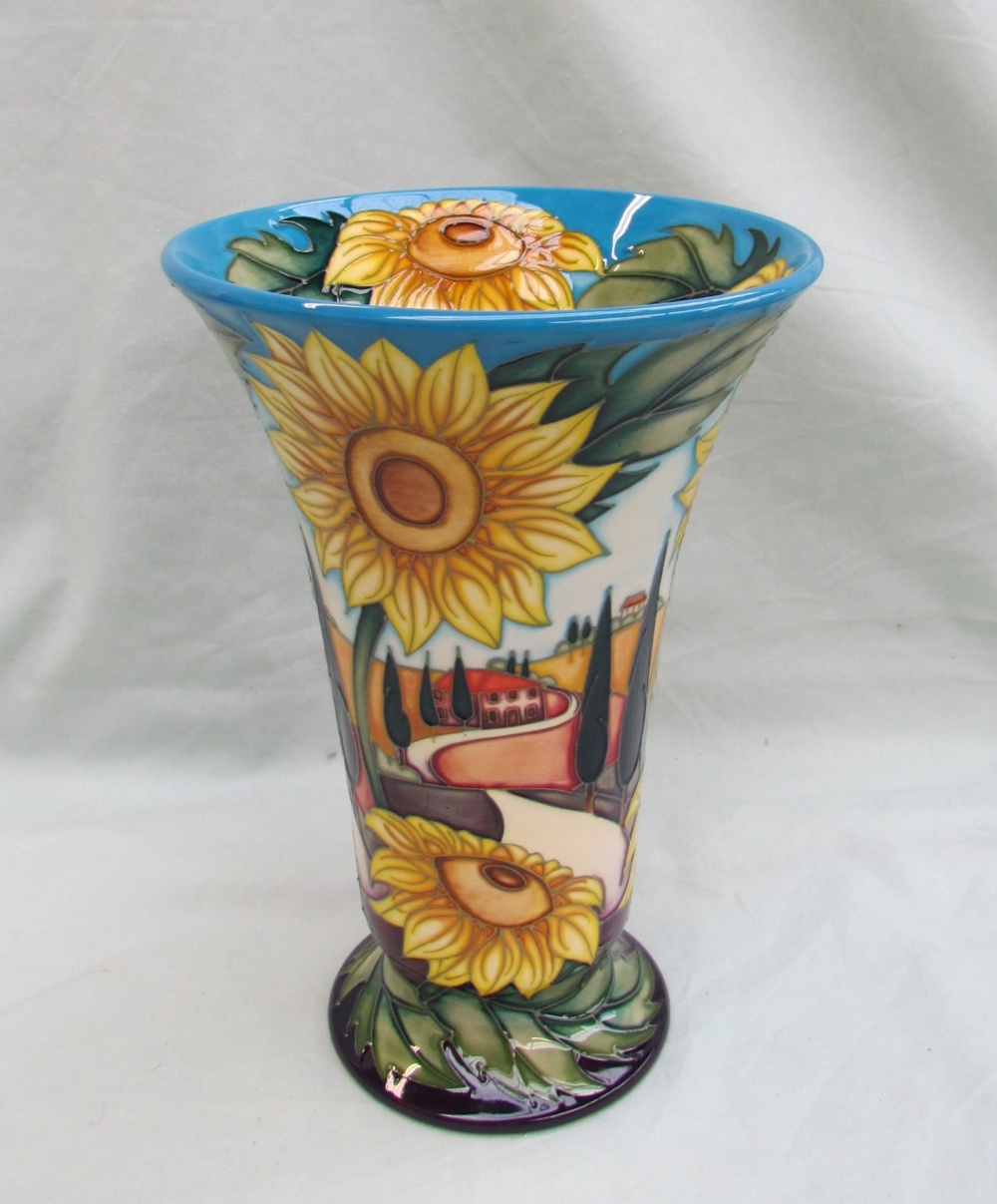 A Moorcroft pottery vase of flared tapering form on a spreading foot decorated in the "White road