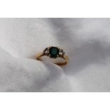 An emerald and diamond ring,