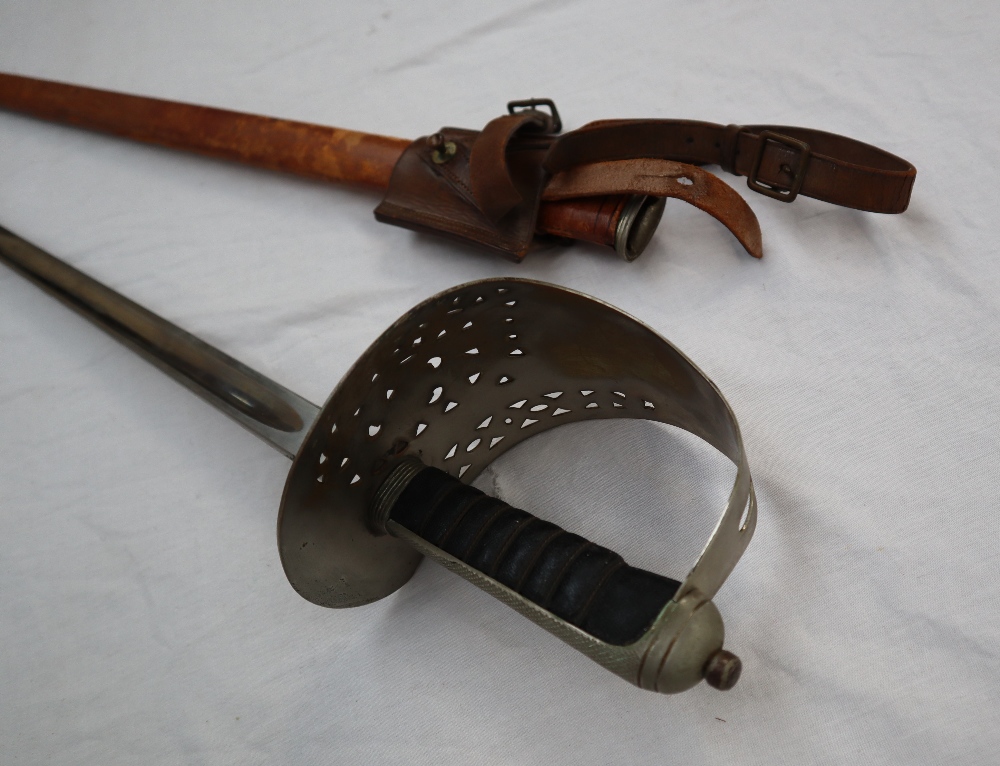 A dress sword with a pierced hand guard and leather grip, - Image 2 of 10