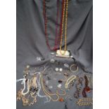Assorted costume jewellery including beaded necklaces, watch,