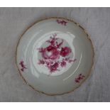 A Meissen porcelain shallow dish, with a gilt rim,