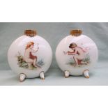 A pair of Mintons porcelain moon flasks painted with a boy chasing a butterfly,