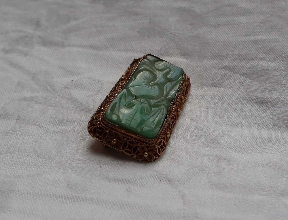 A carved jade panel brooch, to a silver gilt floral scrolling setting, - Image 3 of 4