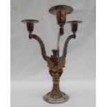 An Aurum silver three branch candleabra, applied with Griffins holding shields,