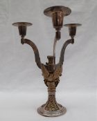 An Aurum silver three branch candleabra, applied with Griffins holding shields,