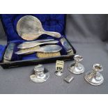 A George V silver dressing table set, comprising a hand mirror, pair of clothes brushes,