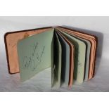 An autograph album, containing various autographs includingh Stanley Matthews, Tom Day,