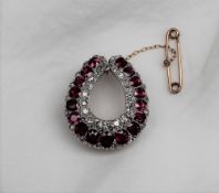 A ruby and diamond brooch,