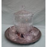 A French crystal punch bowl with a domed lid, ladle and six glasses on an electroplated base,