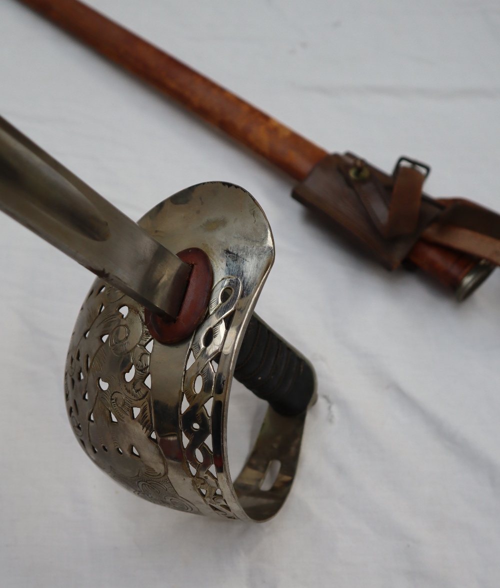 A dress sword with a pierced hand guard and leather grip, - Image 5 of 10