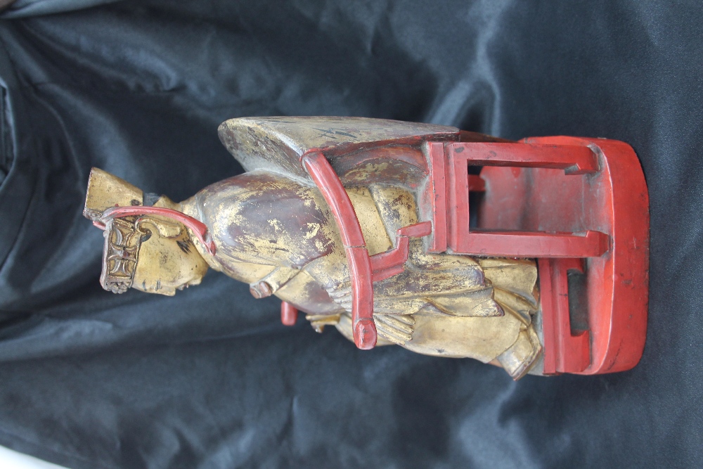 A Chinese carved, gilt and red painted figure of a seated dignitary, - Image 15 of 15