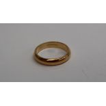 An 18ct yellow gold wedding band, approximately 5.