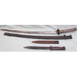 A Japanese samurai sword, the white metal grip with moulded stringing,