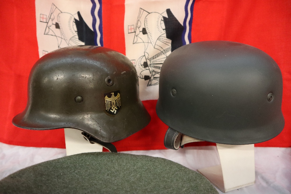 A German helmet, with shield transfers applied, together with another helmet, a peaked cap, a beret, - Image 3 of 7