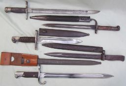 A bayonet, the blade marked "Modelo Argentino 1909", with scabbard,