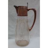 A continental white metal and glass jug,