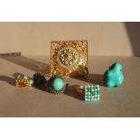 A dress ring, set with twenty five turquoise beads to a yellow metal setting and shank,