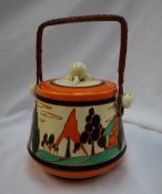 A Clarice Cliff pottery biscuit barrel and cover decorated in the Orange Trees and House pattern,