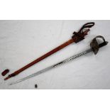 A dress sword with a pierced hand guard and leather grip,