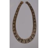 A 9ct yellow and rose gold fringe necklace, with stepped square and rectangular links, 41cm long,