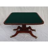 A Regency mahogany card table with a rectangular fold over top with a baize interior on a tapering