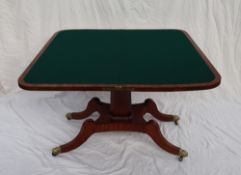 A Regency mahogany card table with a rectangular fold over top with a baize interior on a tapering