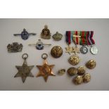 A set of four World War II miniatures, together with The Africa Star and Italy Star medals,