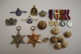 A set of four World War II miniatures, together with The Africa Star and Italy Star medals,