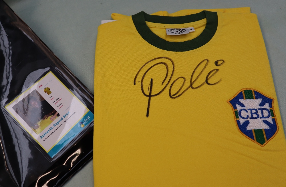 A replica Brazilian football shirt signed by Pele,