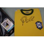 A replica Brazilian football shirt signed by Pele,