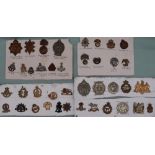 A collection of circa forty military cap badges including Argyle and Sutherland,