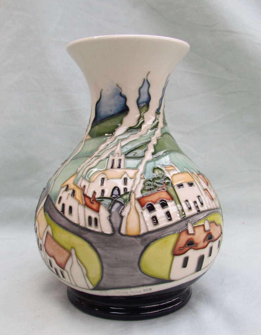 A Moorcroft pottery vase with a flared neck and baluster body decorated in the Sneem pattern,