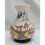 A Moorcroft pottery vase with a flared neck and baluster body decorated in the Sneem pattern,