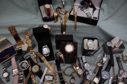 A large collection of Lady's and Gentleman's wristwaches including Michael Kors, Van Heusen, Roamer,