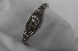 An Art Deco diamond set cocktail watch,