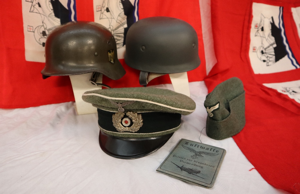 A German helmet, with shield transfers applied, together with another helmet, a peaked cap, a beret, - Image 2 of 7