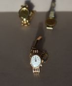 A Lady's 9ct yellow gold wristwatch, the oval dial with batons, inscribed Geneve,