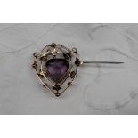 An amethyst and seed pearl brooch of shield shape,