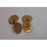 A pair of 18ct yellow gold cufflinks, engraved with a Griffin,