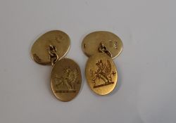 A pair of 18ct yellow gold cufflinks, engraved with a Griffin,