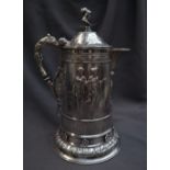 A large Victorian silver lidded jug, the domed top with gladiator head terminal,