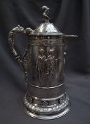 A large Victorian silver lidded jug, the domed top with gladiator head terminal,