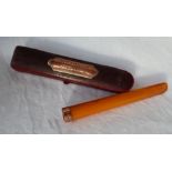 A 9ct yellow gold and amber cheroot holder,