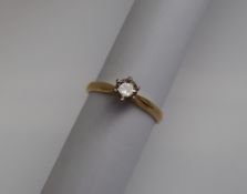 A solitaire diamond ring, the round brilliant cut diamond approximately 0.