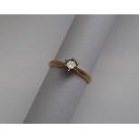 A solitaire diamond ring, the round brilliant cut diamond approximately 0.